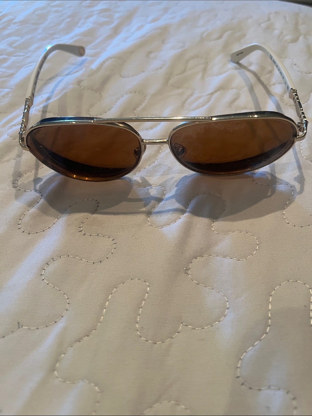 Gold and white Juicy Couture Women's frames.